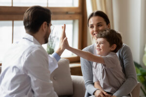 doctor meeting with mom and son